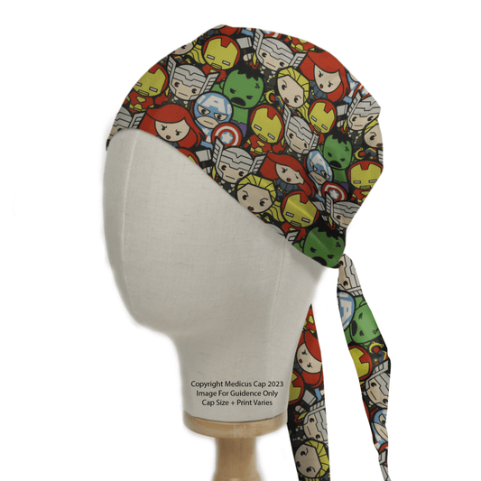 A mannequin head features a Marvel Avengers Cartoon #2 Scrub Cap by Medicus Scrub Caps, displaying vibrant superhero faces on a white background. Ideal for healthcare heroes, this cap ties at the back.