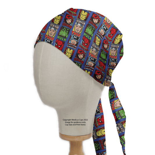 A mannequin head displays the Medicus Scrub Caps Marvel Avengers Comic Book Front Covers Superhero Scrub Cap with vibrant illustrations and bold names of heroes like Iron Man, Thor, and Hulk. This reusable cap ties at the back for a fun yet functional fit.