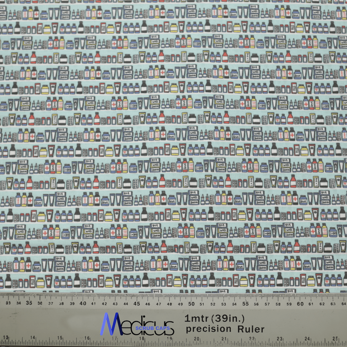 The Medicus Scrub Caps Medical Cabinet Pharmacy Scrub Cap showcases rows of vibrant miniature tea and coffee cups in alternating order. A ruler at the bottom measures the fabric scale at 1 meter (39 inches), ideal for adding warmth to healthcare professionals attire.