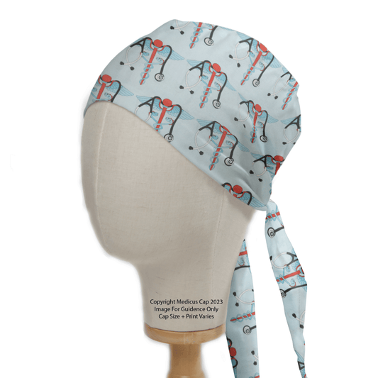 The mannequin head displays a Medicus Scrub Caps Medical Snake Caduceus Logo Blue USA Scrub Cap, with a light blue design and red/blue stethoscopes. Made from eco-friendly fabric, the ties drape behind, with text noting copyright and potential size/print variations.