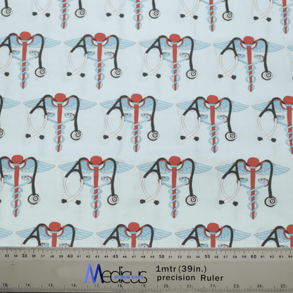 The patterned fabric includes medical snake caduceus symbols with wings, red circles, stethoscopes, and intertwined blue and red rods on a light background. Perfect for the Medicus Scrub Caps Medical Snake Caduceus Logo Blue USA Scrub Cap. Includes a one-meter ruler in centimeters and inches for scale.