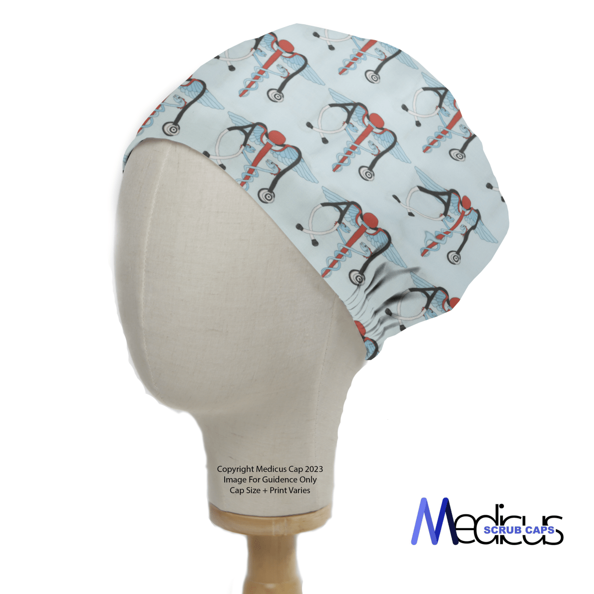 The image displays a mannequin head wearing the Medical Snake Caduceus Logo Blue USA Scrub Cap from Medicus Scrub Caps, featuring medical-themed patterns like stethoscopes and the Caduceus symbol. This cap is sustainable and eco-friendly.