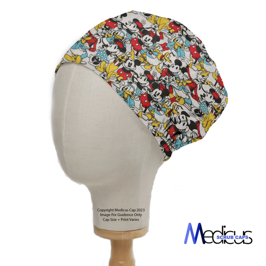 A mannequin head wears the Mickey + Friends Retro Gang Scrub Cap by Medicus Scrub Caps, featuring playful Disney characters in a bold, colorful design that ensures all-day comfort.