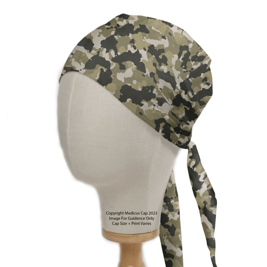 A Medicus Scrub Caps mannequin dons the Military Camouflage Desert Olive Green Scrub Cap, featuring green, brown, and beige hues against a neutral background with faint copyright text on its neck.