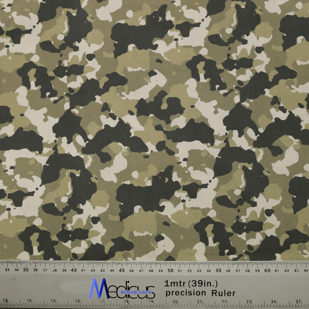 The Military Camouflage Desert Olive Green Scrub Cap by Medicus Scrub Caps features green, black, and white tones, ideal for healthcare professionals. A ruler with 1 mtr (39 in.) precision Ruler markings in cm and inches is partially visible alongside logos.