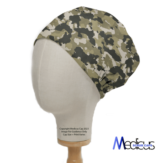 The Military Camouflage Desert Olive Green Scrub Cap from Medicus Scrub Caps rests on a white mannequin head. It smoothly covers the entire head, ideal for healthcare professionals. The stylish text Medicus Scrub Caps appears in blue and gray on the lower right.