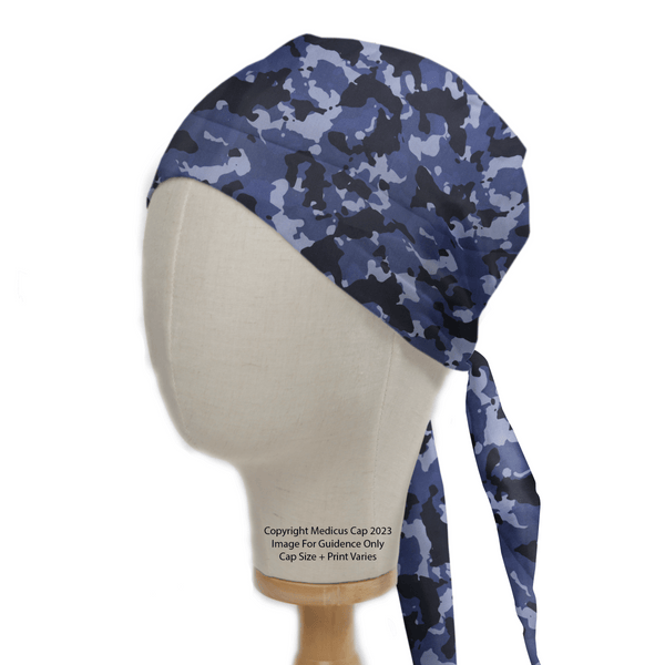 The Medicus Scrub Caps Military Camouflage Navy Scrub Cap, displayed on a mannequin head, features a tied back and blends dark blue, light blue, and black—perfect for healthcare professionals looking for style and fit.