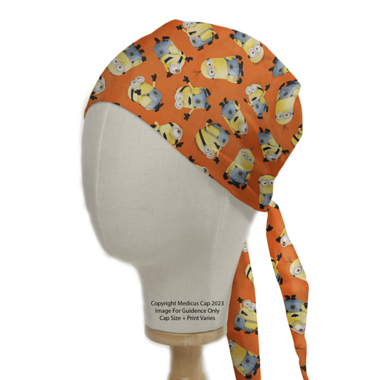 The Minions Orange Scrub Cap by Medicus Scrub Caps features playful yellow characters in blue overalls. Displayed on a white mannequin, its a comfy and durable choice for those prioritizing style and eco-friendliness.