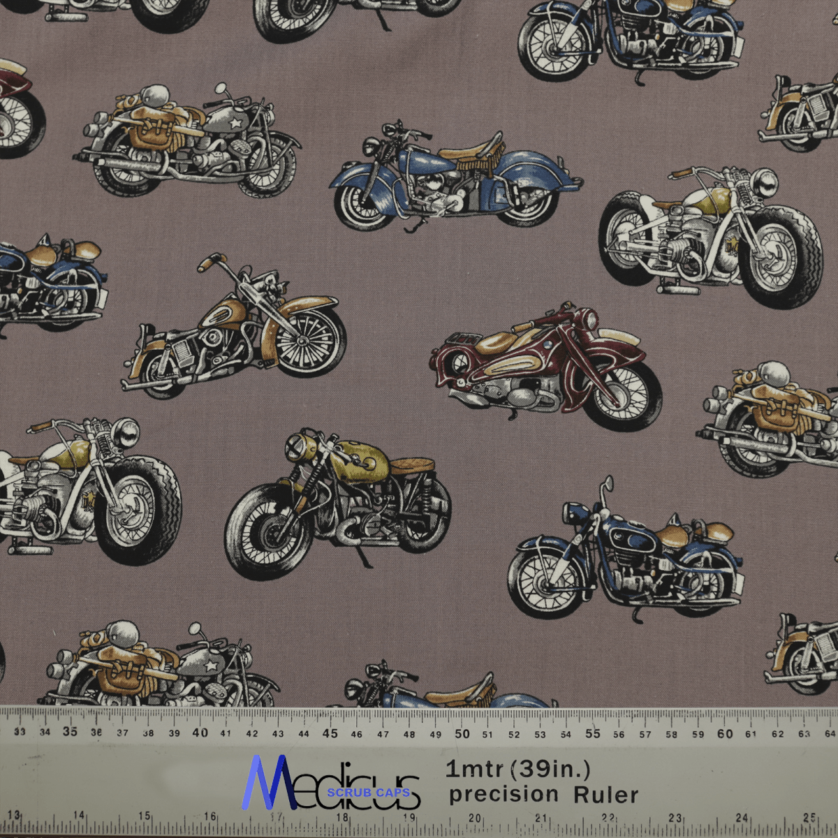 Explore the Medicus Scrub Caps high-quality Motorbike Vintage 1950 fabric, displaying colorful vintage motorcycles on a gray background. Ideal for an eco-friendly scrub cap, it includes a convenient ruler with centimeter and inch measurements.