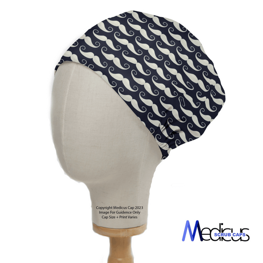 The Medicus Scrub Caps mannequin wears the Moustache Dark Blue Scrub Cap, ideal for medical environments. Its white mustache pattern adds flair, and the plain white background emphasizes its unique design for inclusive healthcare fashion.