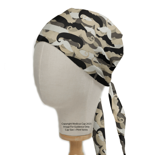 A mannequin head displays a Moustache Madness scrub cap in a beige, gray, and black camo. The reusable Medicus Scrub Cap features back-tie straps. Text below says, “Copyright Medicus Cap 2023. Image for guidance only. Cap size and print varies.”.