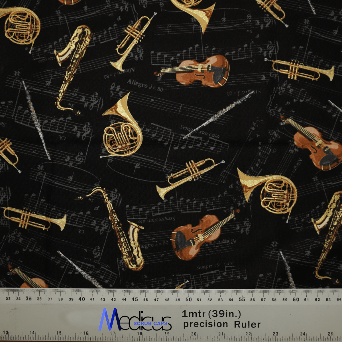 The Musical Instruments Scrub Cap by Medicus Scrub Caps features an eco-friendly fabric with violins, French horns, and saxophones on a black background with musical notes. A one-meter ruler is shown at the bottom for scale.