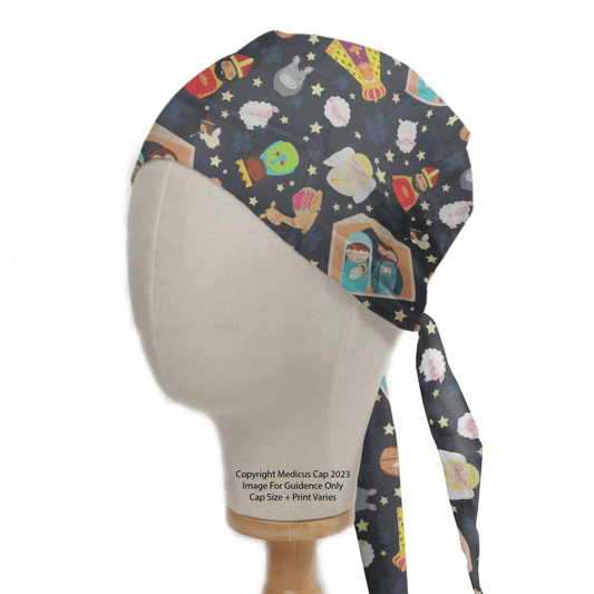 A Medicus Scrub Caps mannequin displays the Nativity Scene Christmas Scrub Cap, featuring a festive design with astronauts, planets, rockets, and stars on a dark background.