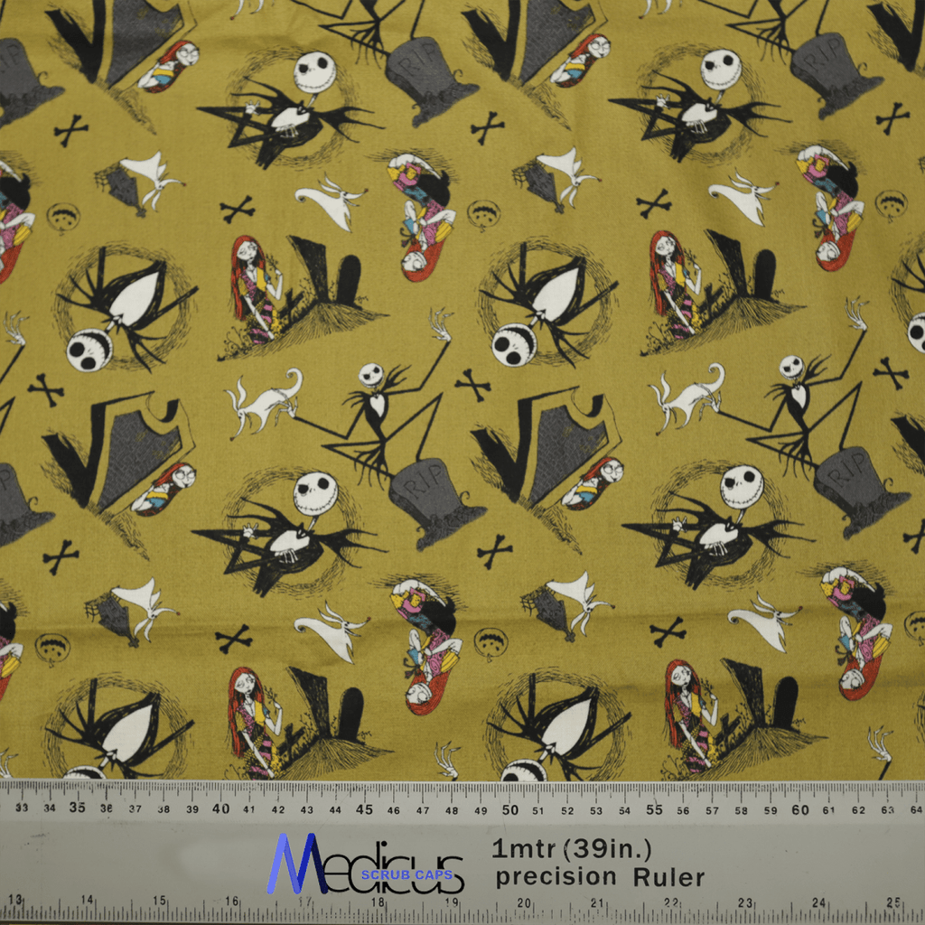 The Nightmare Before Christmas #2 Scrub Cap from Medicus Scrub Caps features a whimsical design with cartoon skeletons, ghosts, and other Halloween characters on a yellow background. A ruler at the bottom shows measurements in inches and meters.