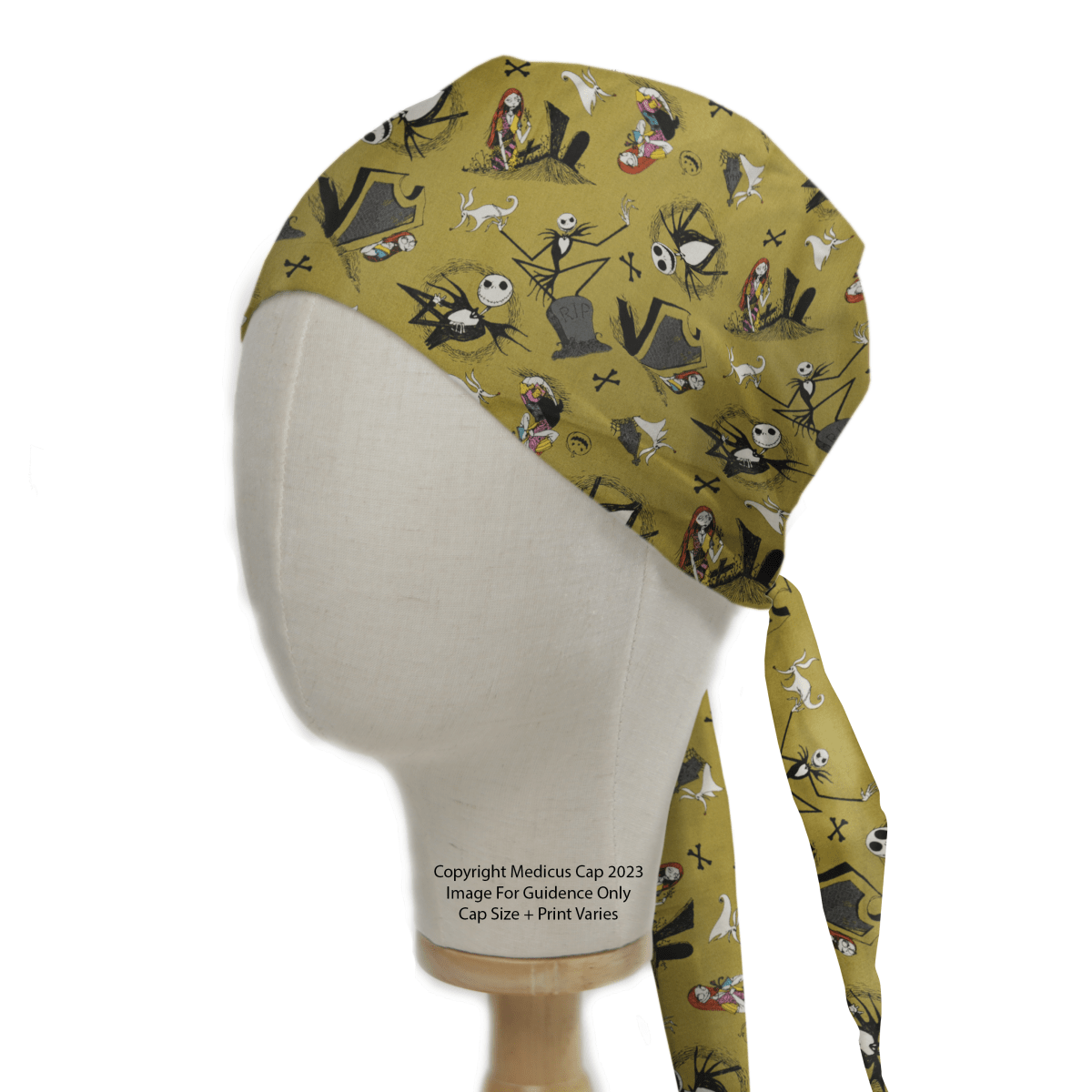 The mannequin head showcases a Medicus Scrub Caps Nightmare Before Christmas #2 green scrub cap, featuring spooky-themed illustrations and quirky characters, providing a whimsical and sustainable option for work.