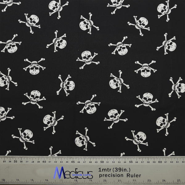 The Medicus Scrub Caps Pirate Skulls Classic Black + White features a black fabric with white skull and crossbones, ideal for crafting a comfortable healthcare scrub cap. The ruler at the bottom ensures precise measurement for a perfect fit.