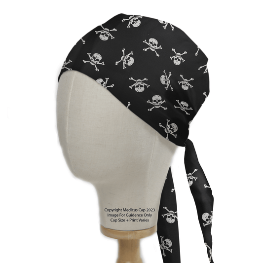 A mannequin head showcases the Pirate Skulls Classic Black + White Scrub Cap by Medicus Scrub Caps. The cap features a black and white skull and crossbones pattern, ties at the back, and offers a comfortable fit ideal for healthcare attire.