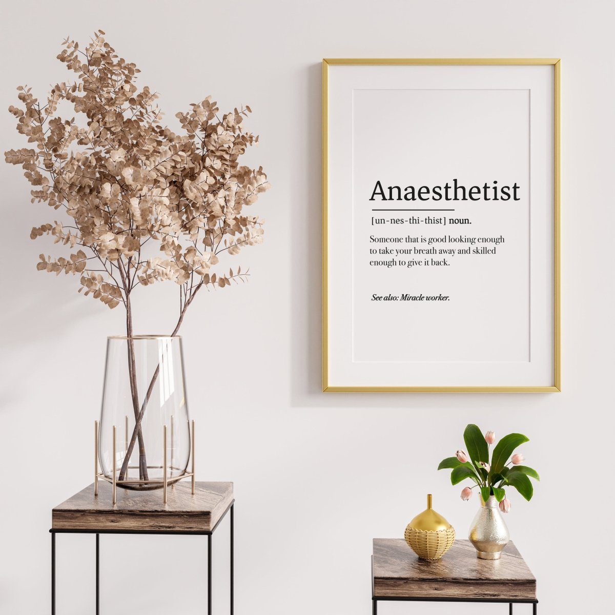 A customizable Medicus Scrub Caps Anaesthetist Definition Poster, available as a digital download, celebrates their skill and bravery. It hangs above tables with dried flowers and a golden ornament, harmonizing with the minimalist decor in natural tones.