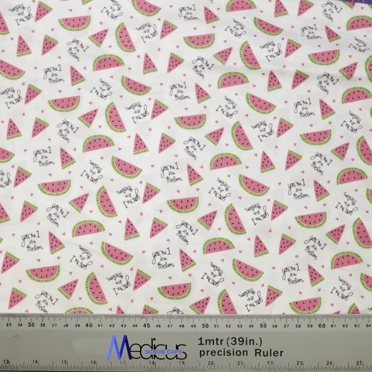 The Pun-tastic: 1 in a Melon Scrub Cap by Medicus Scrub Caps features an eco-friendly, white patterned fabric with watermelon slices and phrases like youre one in a melon, accented in pink, green, and black. It supports healthcare workers and includes measurements with logos at the bottom.