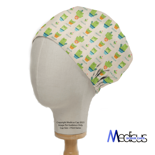 A mannequin head showcases the Pun-tastic: Cat-cus Scrub Cap from Medicus Scrub Caps, featuring playful frog patterns and a gathered back. The design includes Medicus text with a medical cross symbol. A copyright notice by Medicus Cap completes this sustainable piece of medical apparel.