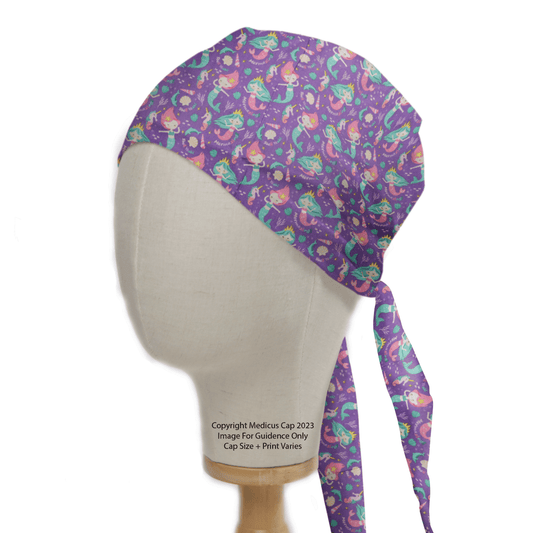 The Medicus Scrub Caps Pun-tastic: Mermazing! Scrub Cap features colorful mermaid patterns, ties at the back with long cascading strips, and displays vibrant mermaids and sea elements for an eco-conscious stylish look.