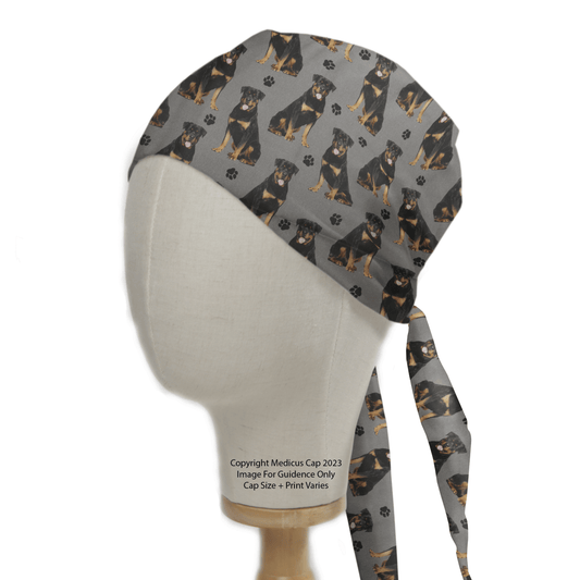 Medicus Scrub Caps presents the Rottweiler Dogs Grey Scrub Cap, featuring a charming Rottweiler and paw print pattern on a stylish grey background.