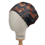The Medicus Scrub Caps Sausage Dachshund Dog Scrub Cap features a navy background with prints of brown and black sausage dachshunds in various poses—ideal for healthcare professionals.