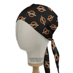 A mannequin head models a Medicus Scrub Caps eco-friendly black scrub cap adorned with a playful pattern featuring an orange circle and slash over the white and orange word BAZINGA! from Science Big Bang Theory, stylishly tied at the back.