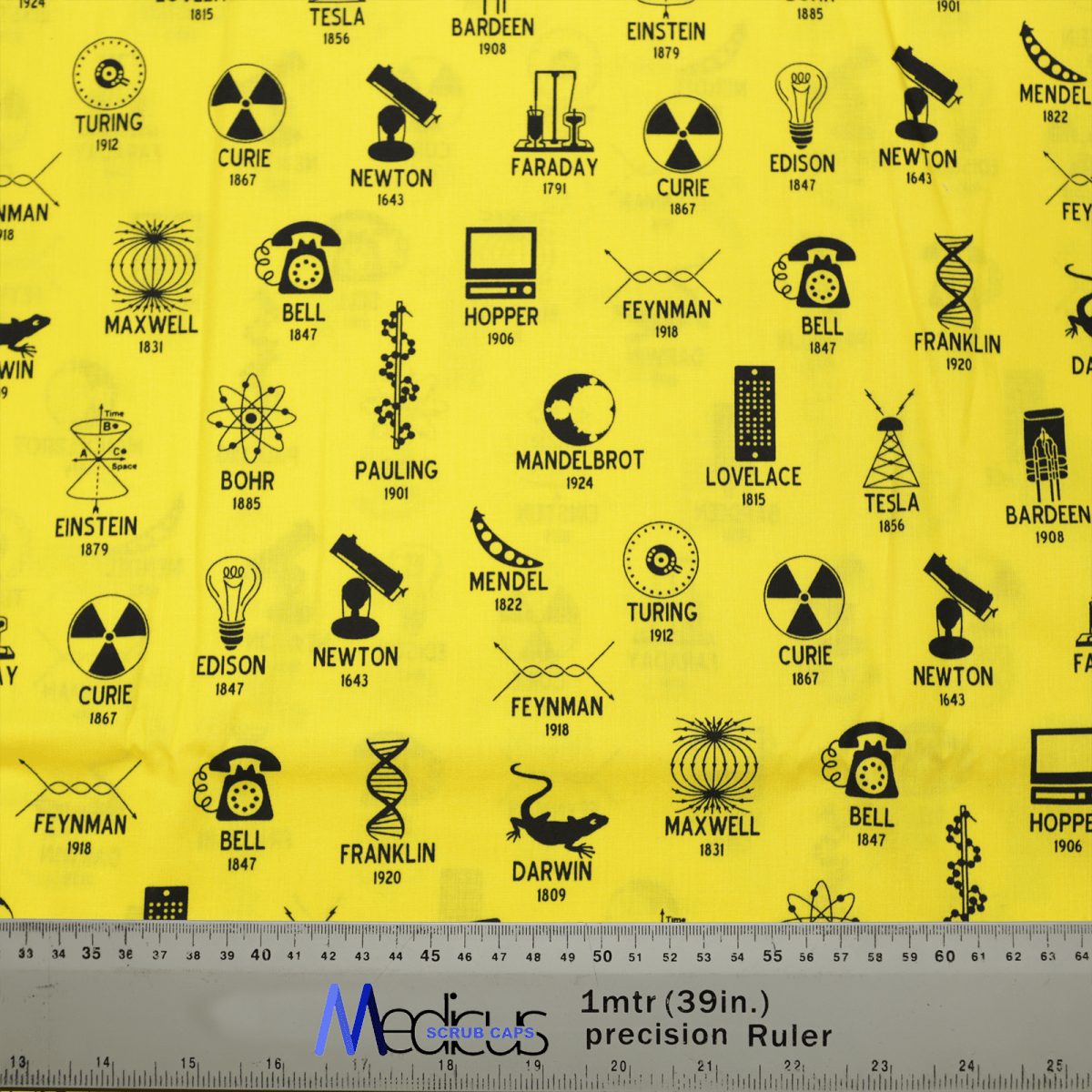 The Science Founders Scrub Cap by Medicus Scrub Caps is made from sustainable yellow fabric featuring icons and names of scientists like Tesla, Einstein, and Curie. It includes symbols like atoms and gears, complemented by a grey ruler with metric and imperial measurements at the bottom.