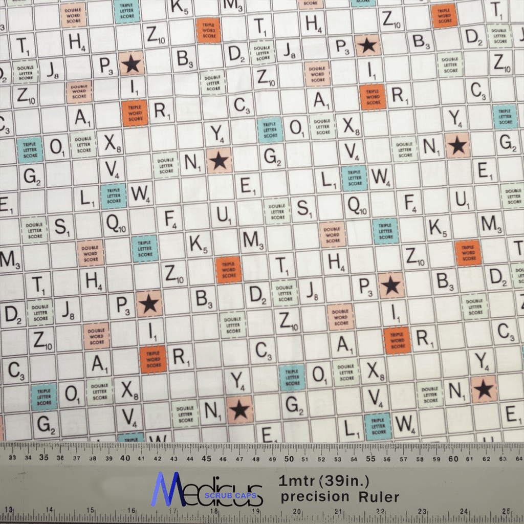 An image shows a Scrabble board pattern with various letters and special scoring squares. At the bottom, a 1mtr (39in) precision Ruler with a logo is present, reminiscent of professional style for those embracing the Medicus Scrub Caps Scrabble Board Scrub Cap look.