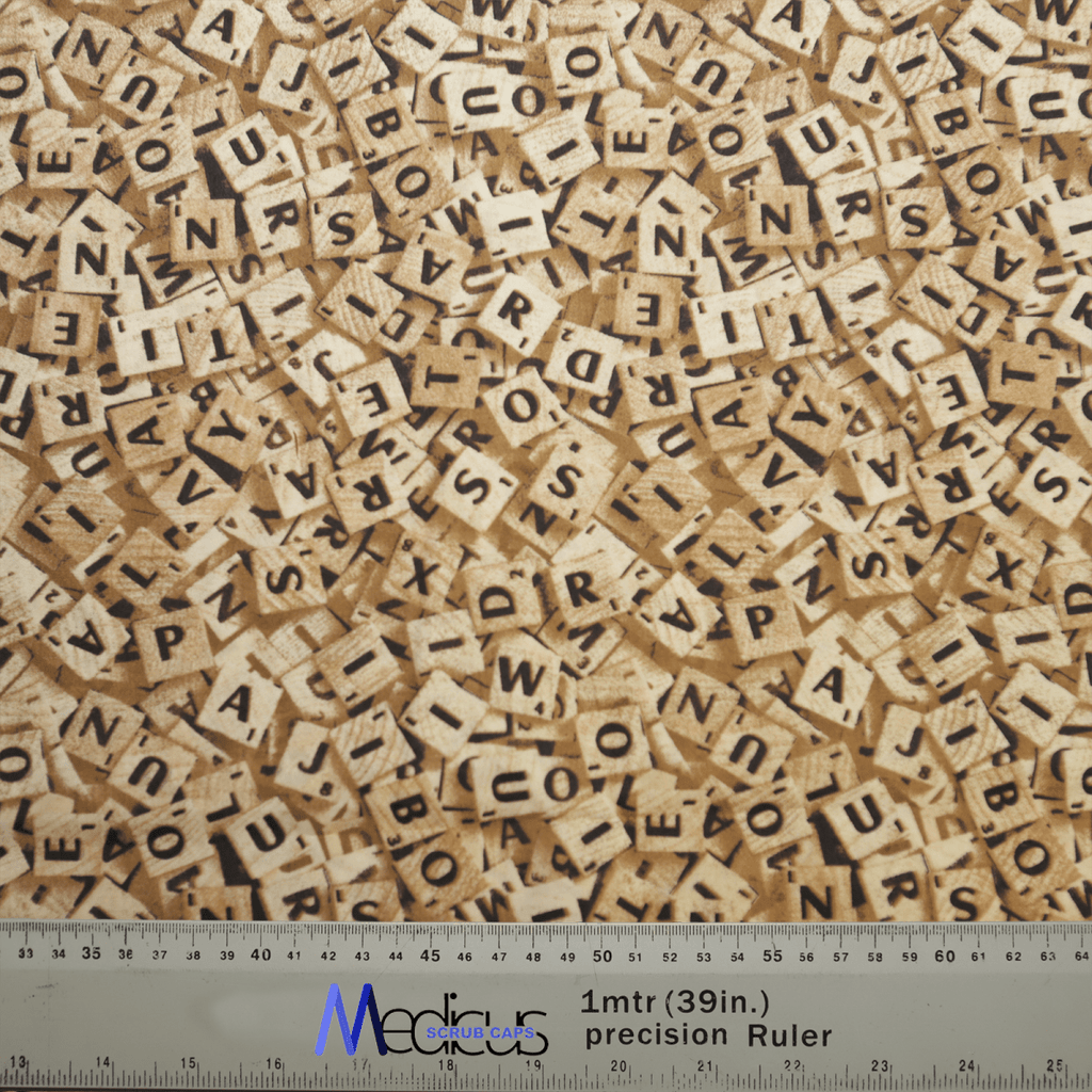 A chaotic pile of wooden Scrabble tiles, covering the surface like an intricate Medicus Scrub Caps Scrabble Letters Scrub Cap. A ruler at the bottom shows measurements in inches and centimeters labeled 1 mtr (39 in.) precision Ruler in blue.