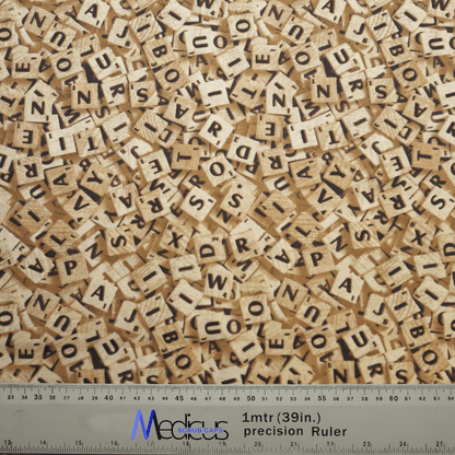 A chaotic pile of wooden Scrabble tiles, covering the surface like an intricate Medicus Scrub Caps Scrabble Letters Scrub Cap. A ruler at the bottom shows measurements in inches and centimeters labeled 1 mtr (39 in.) precision Ruler in blue.