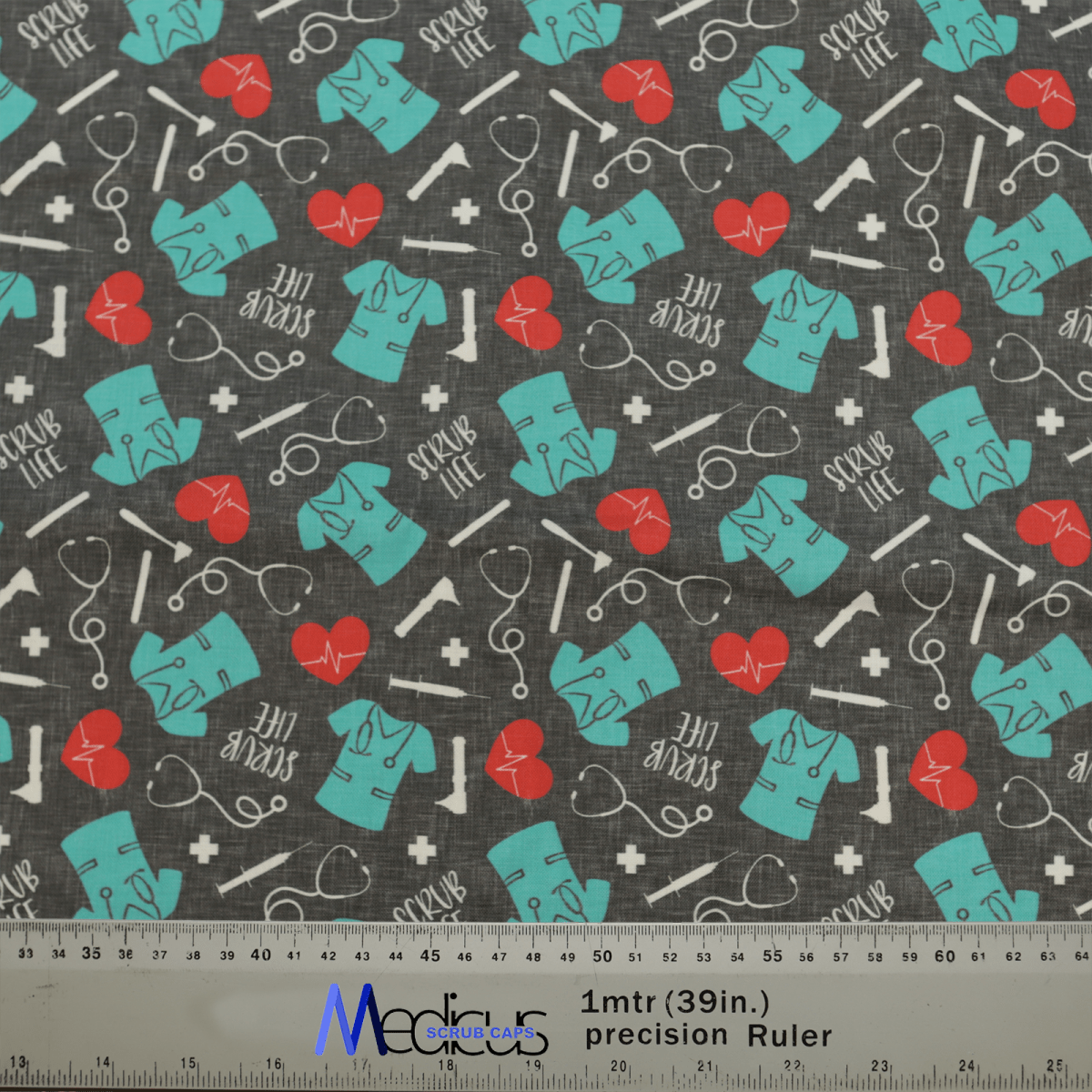 The Scrub Life Scrub Cap by Medicus Scrub Caps features a teal scrub pattern with red hearts, lifelines, stethoscopes, and SCRUB LIFE text on a dark background—a tribute to healthcare professionals. A ruler for scale is included at the bottom.