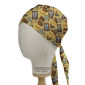 A head mannequin displays the Seinfeld Wallpaper Scrub Cap by Medicus Scrub Caps, featuring historical-themed illustrations, portraits, cartoon cats, and Schrödinger. The cap is crafted for an eco-friendly and comfortable fit with tied tails at the back.