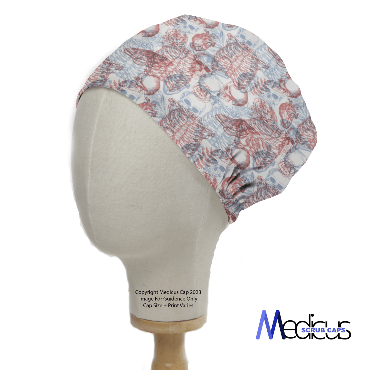 A mannequin showcases the Medicus Scrub Caps Skeleton 3D Vision scrub cap with pink cats and butterflies on a white backdrop, subtly ruched at the back. The Medicus logo sits in the bottom right corner, adding a professional touch to this whimsical design.