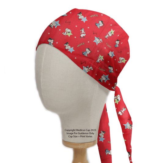 The Medicus Scrub Caps Snoopy Charlie Hug Red Scrub Cap features a sustainable, reusable design with a cartoon nurse character and nurse print. Displayed on a mannequin head, it includes long ties at the back, adding charm to your scrubs.