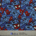 The Spiderman Comic Web Grid Scrub Cap by Medicus Scrub Caps features blue fabric with Spider-Man in various poses, spider web designs, and black spiders, ideal for a reusable scrub cap. A ruler at the bottom indicates scale at 1 meter or 39 inches.