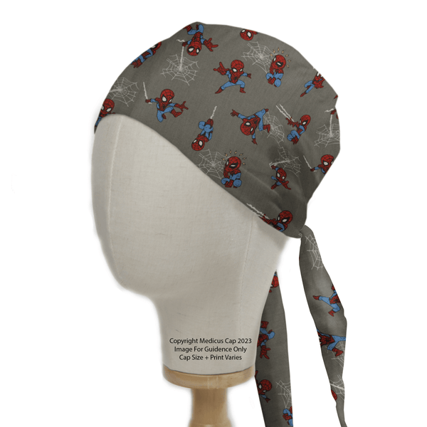 The Medicus Scrub Caps Spiderman Kawaii On Grey Scrub Cap showcases a vibrant red and blue Spiderman design with spider webs on gray fabric, displayed on a mannequin head, and is crafted to provide healthcare professionals with exceptional fit and comfort.