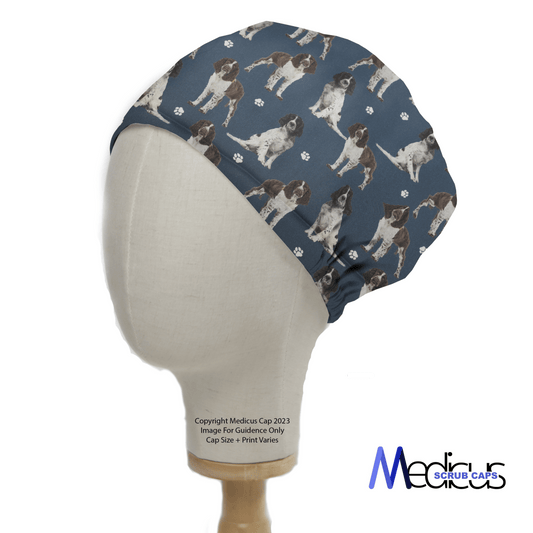 Springer Spaniel Dogs Blue Scrub Cap from Medicus Scrub Caps, featuring a dog pattern on a blue background, displayed on a mannequin head.