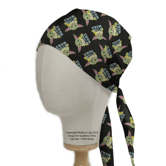 A Medicus Scrub Caps black Star Wars Baby Yoda Profile scrub cap, featuring an adorable green Baby Yoda-like character with huge ears and the text Star Nurse Wars, is displayed on a mannequin head, perfectly blending Star Wars charm with functional style.