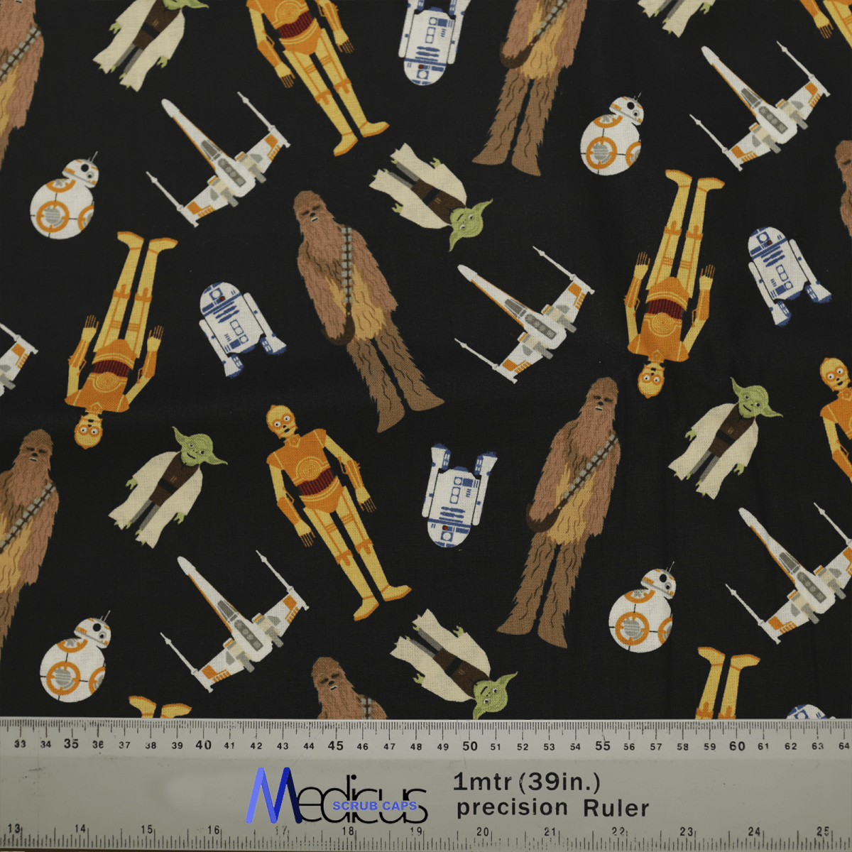 The Medicus Scrub Caps Star Wars Character Toss features iconic characters and starships on a black background, perfect for custom scrub caps. A ruler provides measurements.