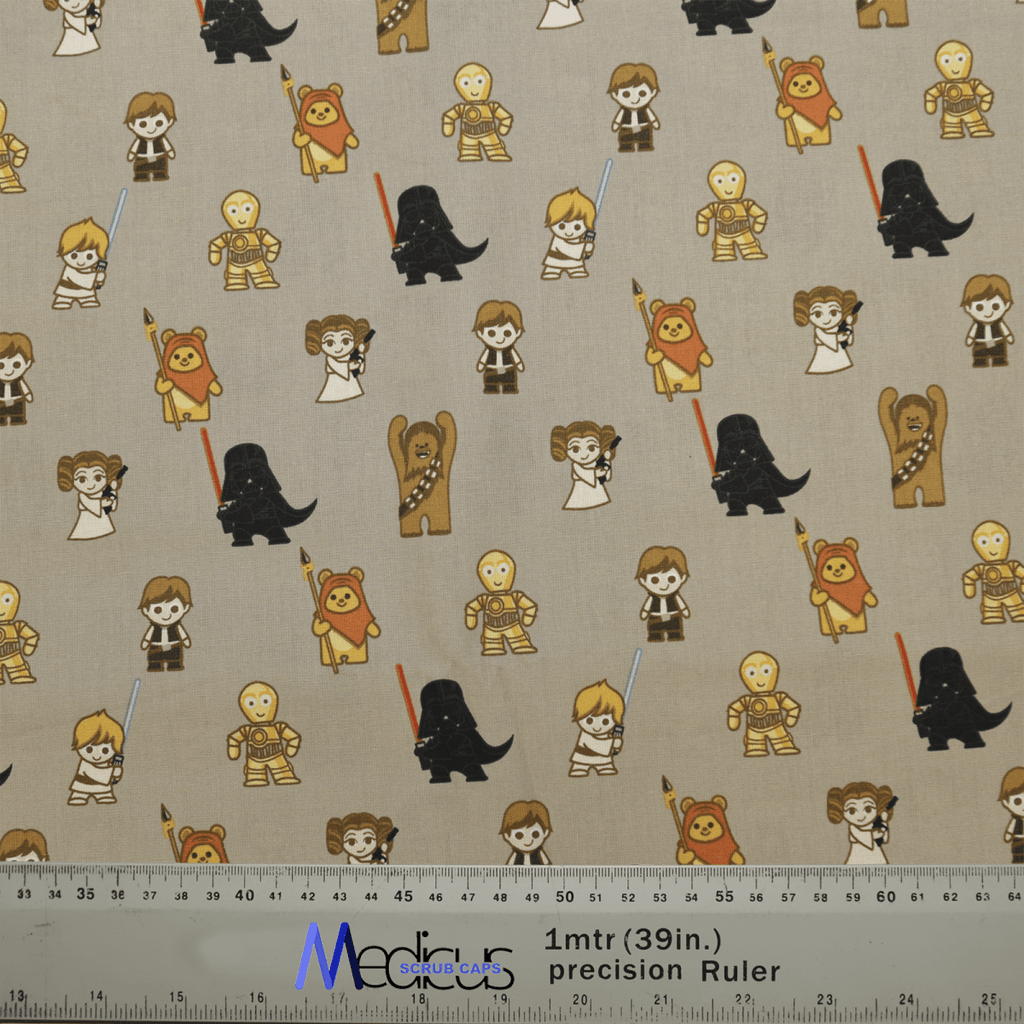The eco-friendly Star Wars on Khaki Beige Kawaii Scrub Cap by Medicus Scrub Caps features kawaii characters, some with lightsabers, across a beige background. A 1-meter (39-inch) ruler at the bottom shows scale.