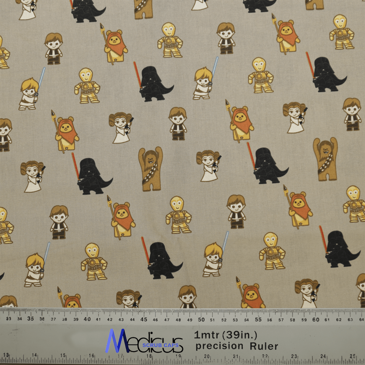 The eco-friendly Star Wars on Khaki Beige Kawaii Scrub Cap by Medicus Scrub Caps features kawaii characters, some with lightsabers, across a beige background. A 1-meter (39-inch) ruler at the bottom shows scale.