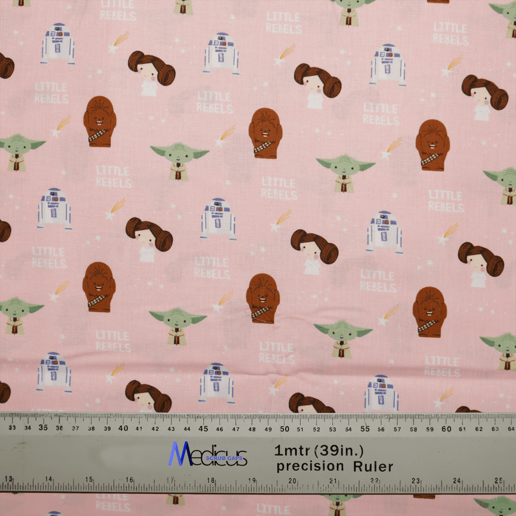 Medicus Scrub Caps Star Wars Pink Kawaii Scrub Cap features pink fabric with whimsical sci-fi characters like robots and aliens. Text reads Little Rebels beside a 1-meter (39-inch) precision ruler, offering a sustainable option for projects.
