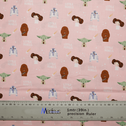 Medicus Scrub Caps Star Wars Pink Kawaii Scrub Cap features pink fabric with whimsical sci-fi characters like robots and aliens. Text reads Little Rebels beside a 1-meter (39-inch) precision ruler, offering a sustainable option for projects.