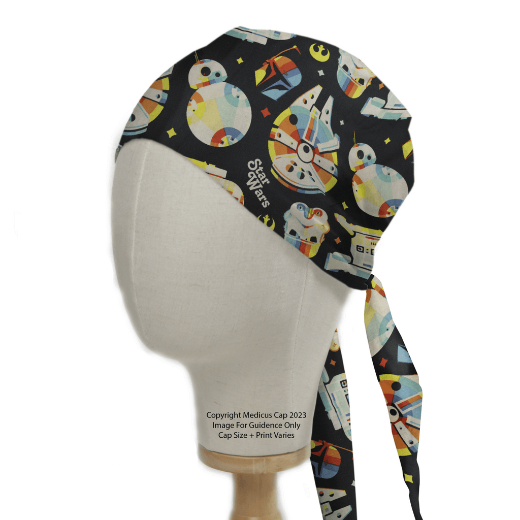 A mannequin head displays a Star Wars Pride Spaceships Scrub Cap by Medicus Scrub Caps, featuring a colorful spaceship design on a black background with tie-back closure.