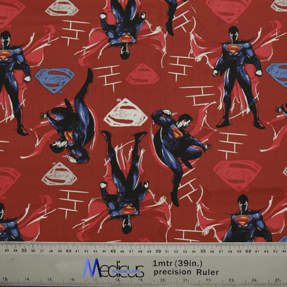 Medicus Scrub Caps presents the Superman Fighting Red Scrub Cap, featuring vibrant red fabric with superhero patterns. Blue and red figures with capes embellish the design alongside scattered emblems. Perfect for healthcare heroes, its adjustable and includes a scale in inches and centimeters.