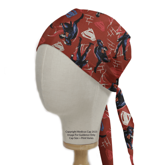 A mannequin head wears the Medicus Scrub Caps Superman Fighting Red Scrub Cap, featuring action-ready superhero designs with diamonds. This adjustable cap, tied at the back, blends style with practicality.