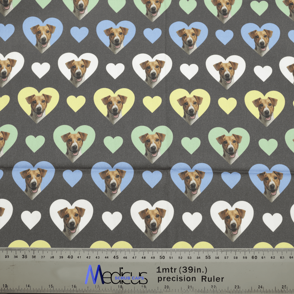 The Sweetheart Jack Russell Dogs Hearts Scrub Cap from Medicus Scrub Caps features Jack Russell faces in colorful heart shapes on a dark background, with a measurement ruler below.