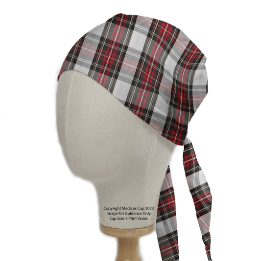 A mannequin head showcases a Medicus Scrub Caps Tartan Red White Scrub Cap, featuring a red, black, and white plaid design tied at the back. Perfect for healthcare professionals seeking stylish reusable scrub caps.